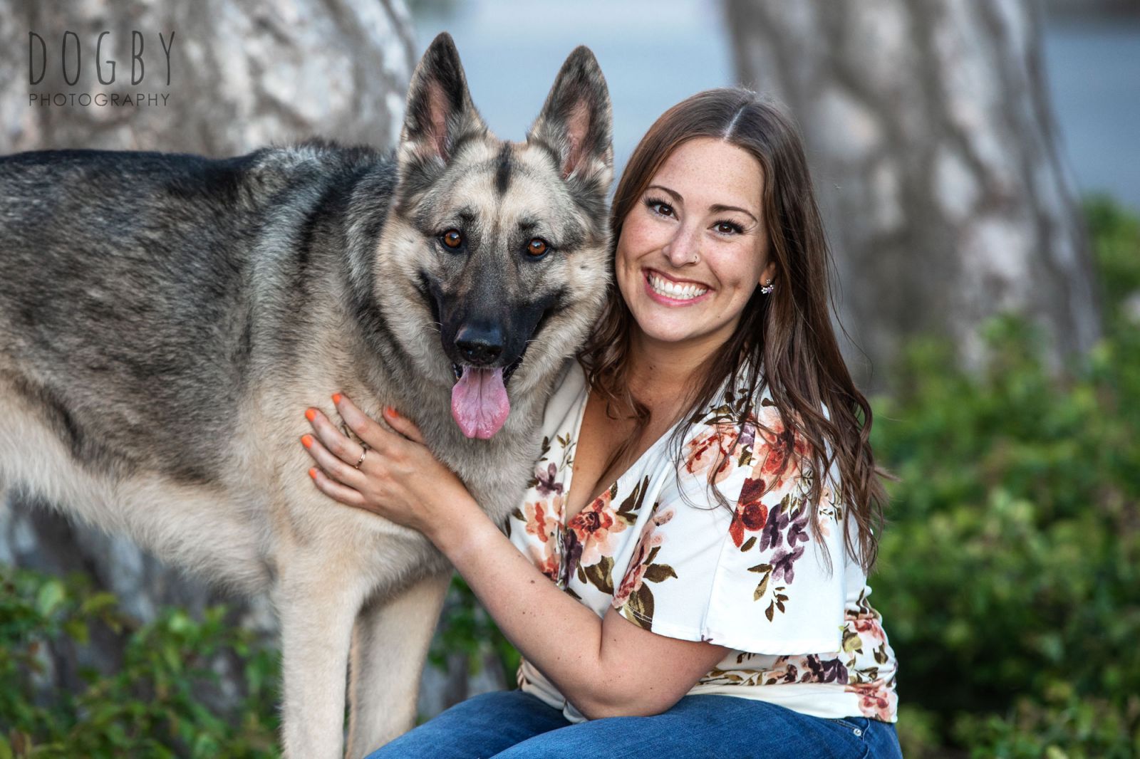 German Shepherd sitting with a girl